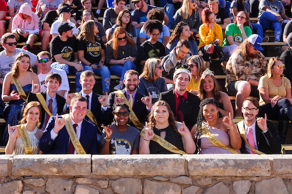Students cheering during an Emporia State University football game