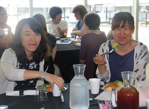 Two women eating dinner