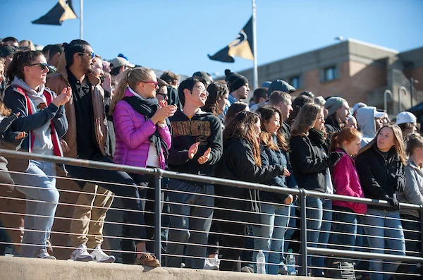 Students cheering at football game