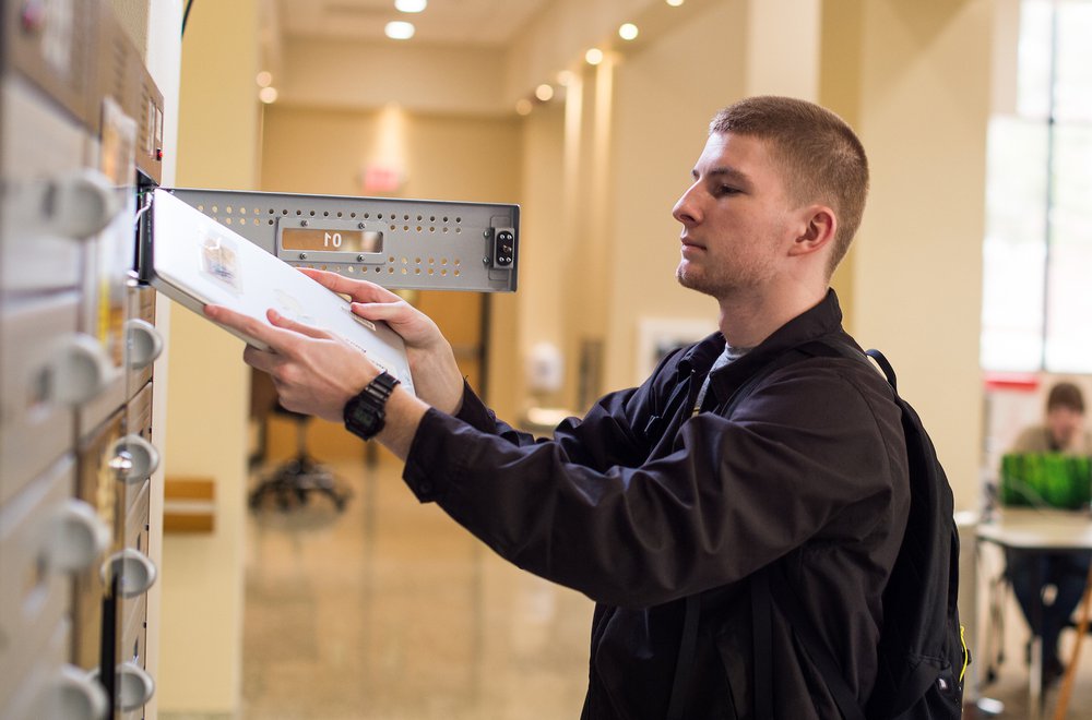 Library Student Checking out Laptop .jpg