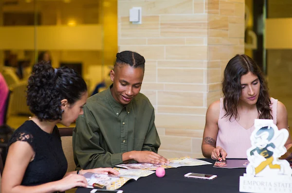 Students reviewing brochure