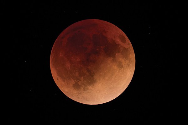 A full moon appears red during a total lunar eclipse in 2022